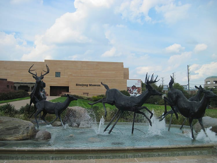 Deer sculptures racing across a fountain at the Eiteljorg Museum of American Indians and Western Art