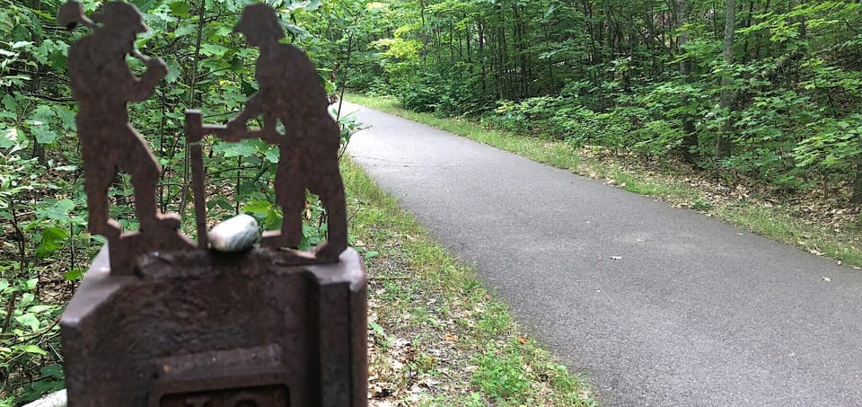 Bike path with artistic trail marker